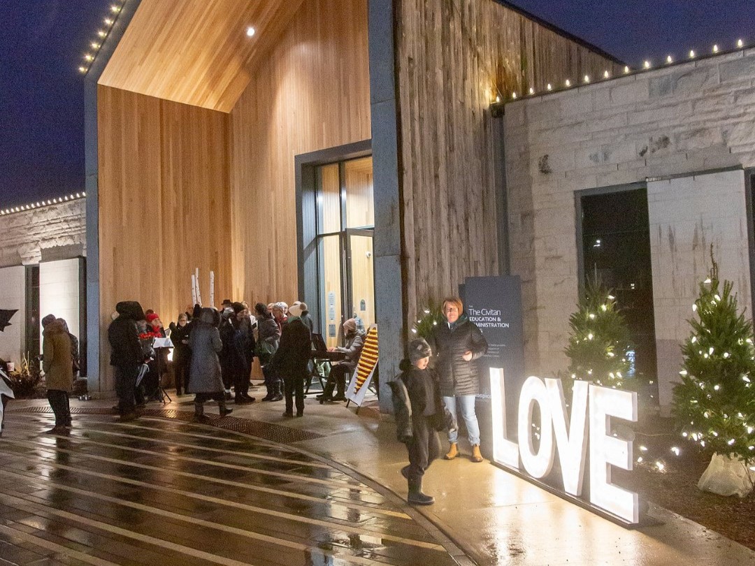 The front of The Gies Family Centre with the Love sign in the foreground.