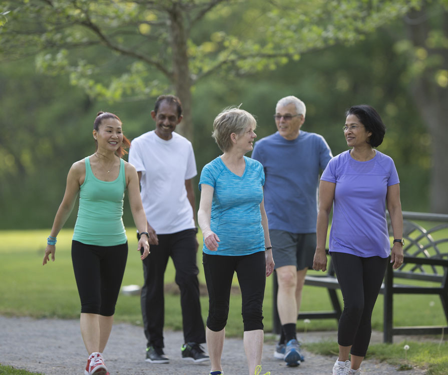 A group of people walking in a field